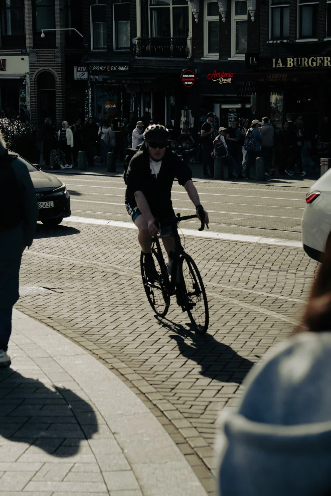 Cyclist through a layered street
