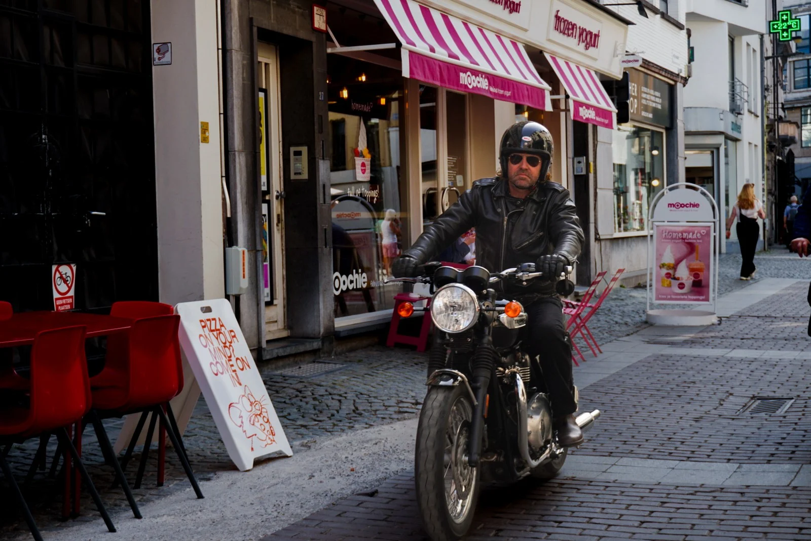 Motorcyclist on a cobbled lane