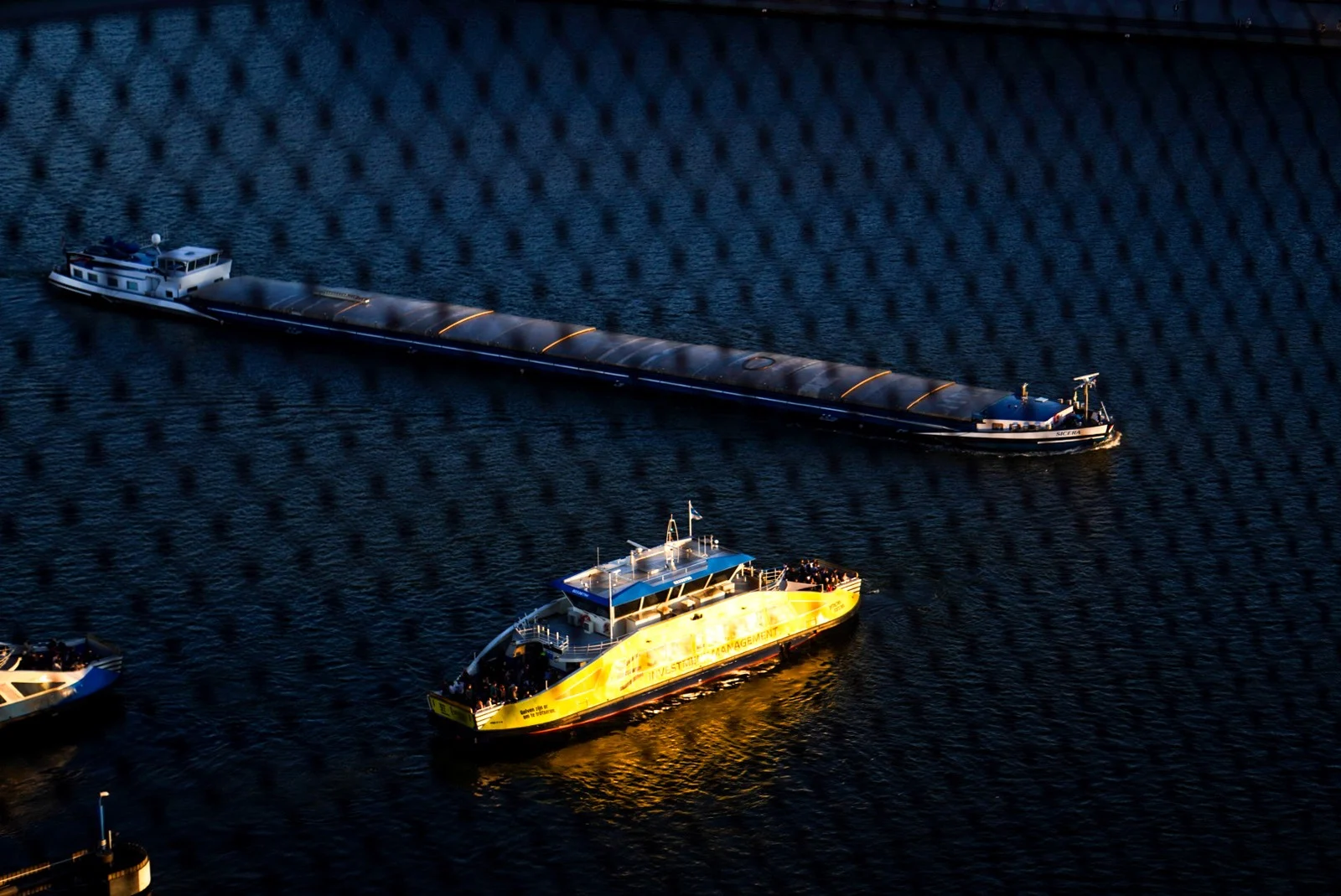 Yellow ferry seen through mesh